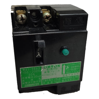 Black electrical component with green label on a white background