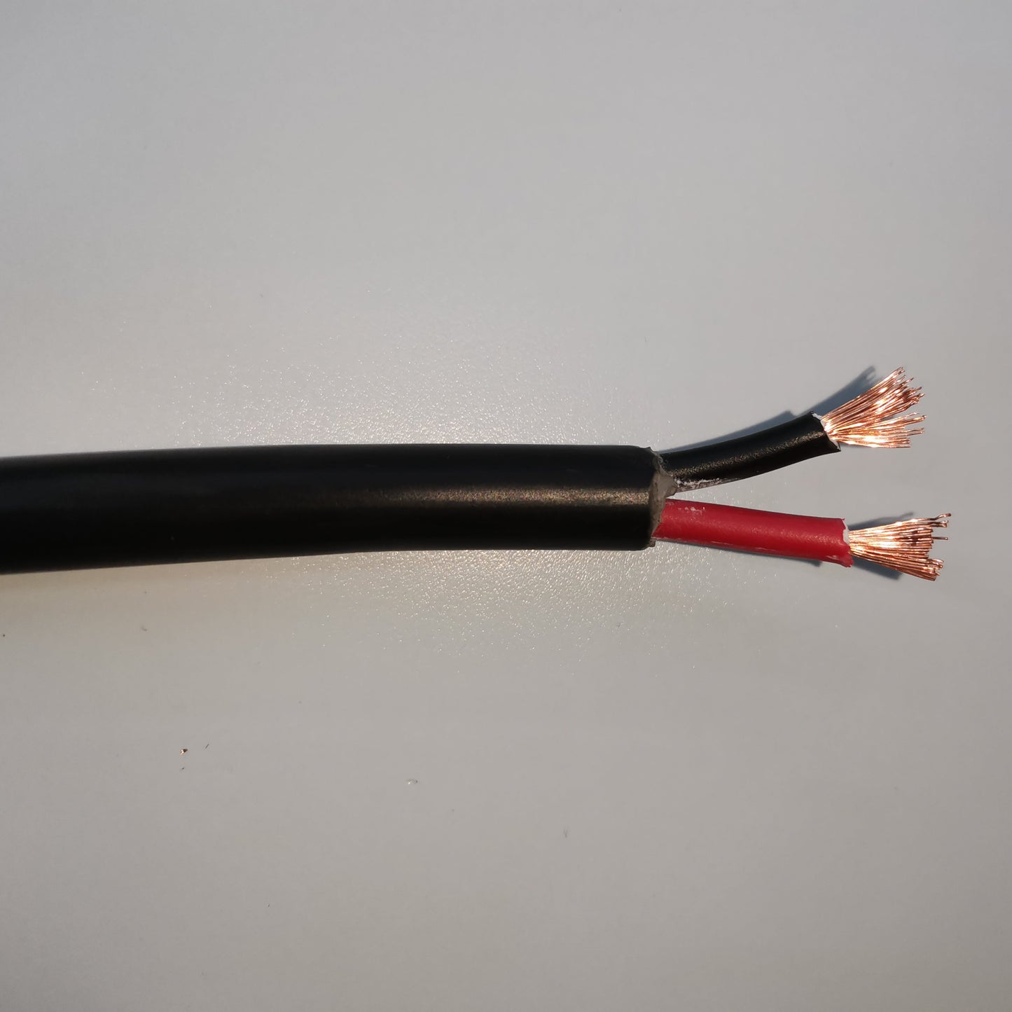 Phelps Dodge 18 gauge 2 core electrical wire with black and red insulated copper strands exposed