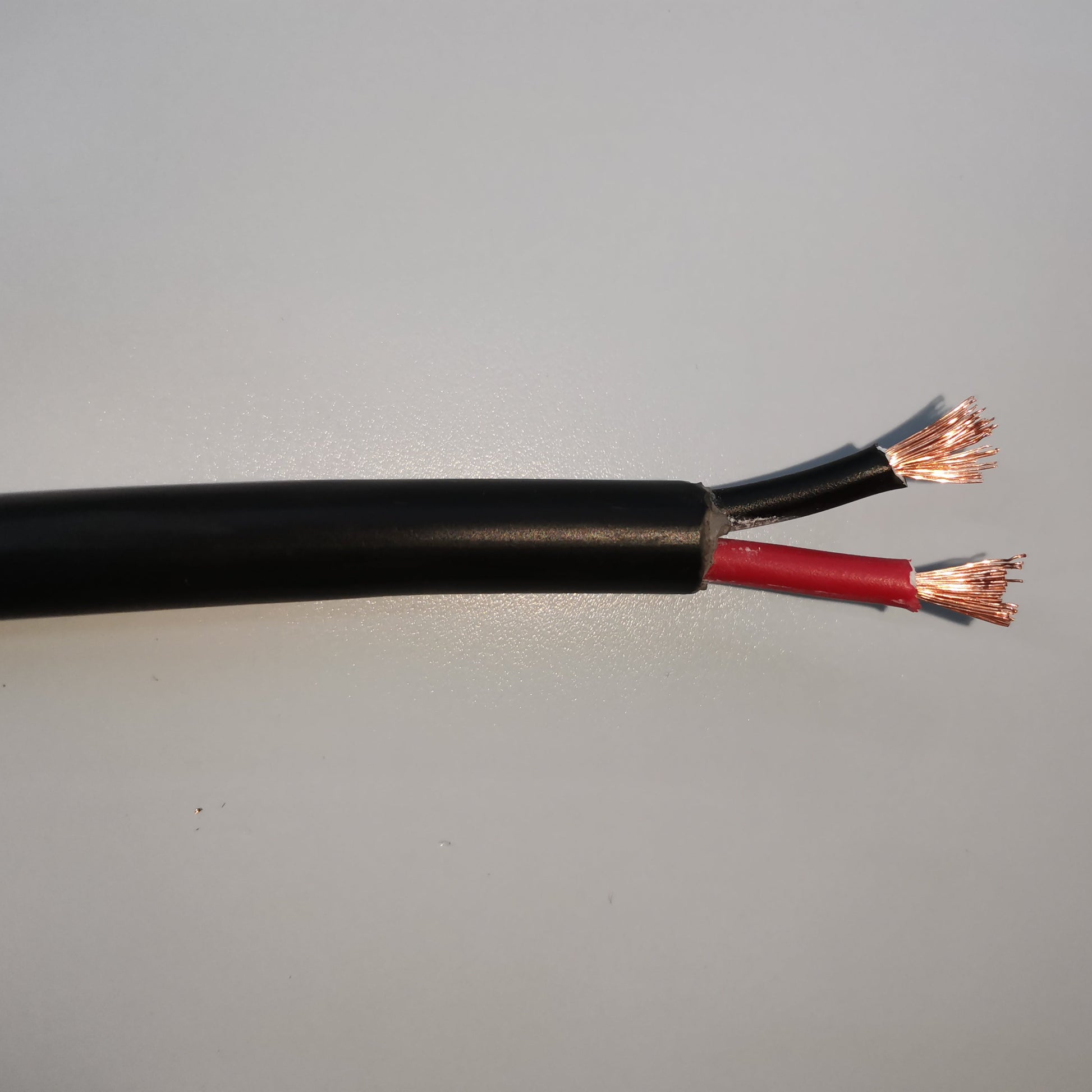 Phelps Dodge 18 gauge 2 core electrical wire with black and red insulated copper strands exposed