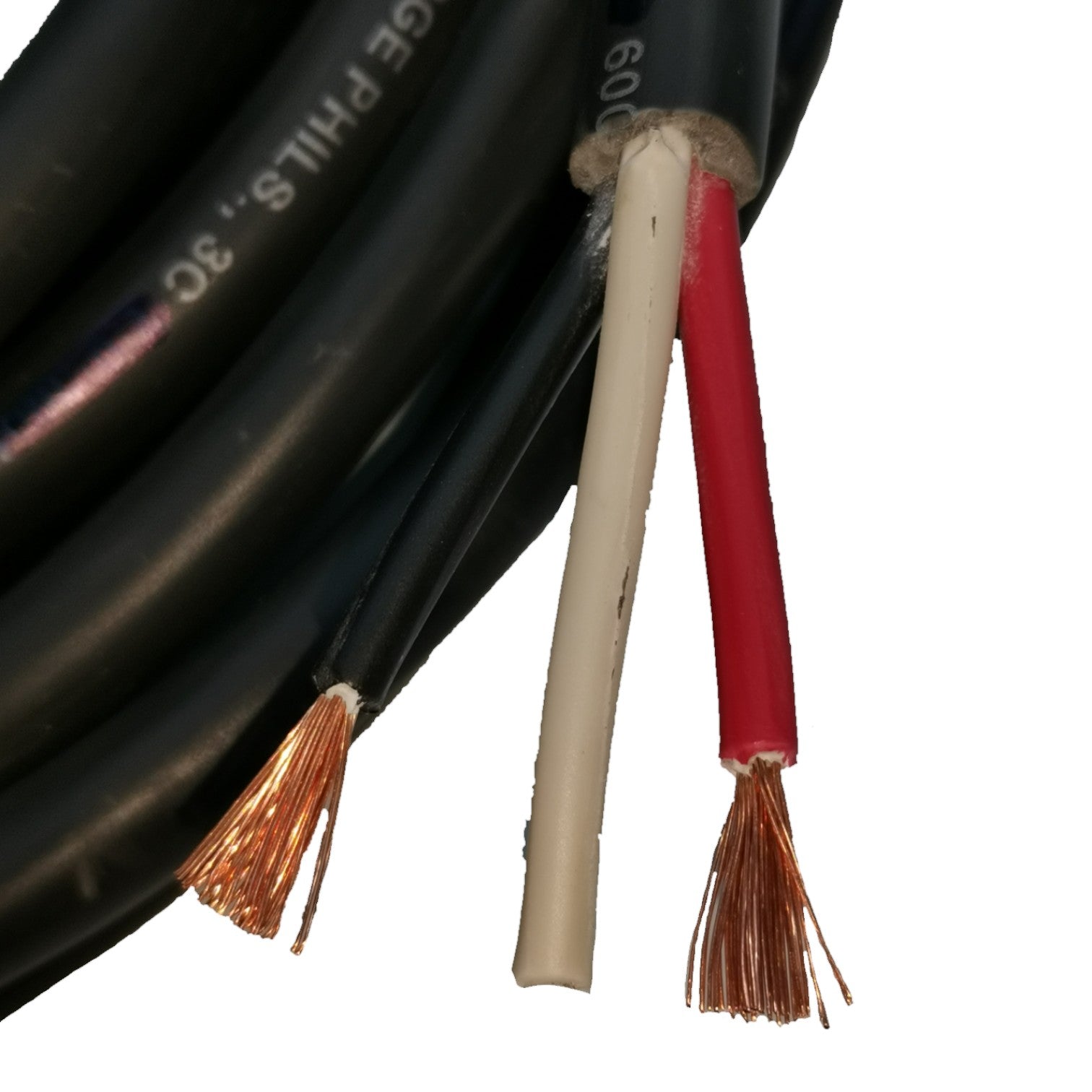 Close-up of black, beige, and red cables with exposed copper wires on a white background