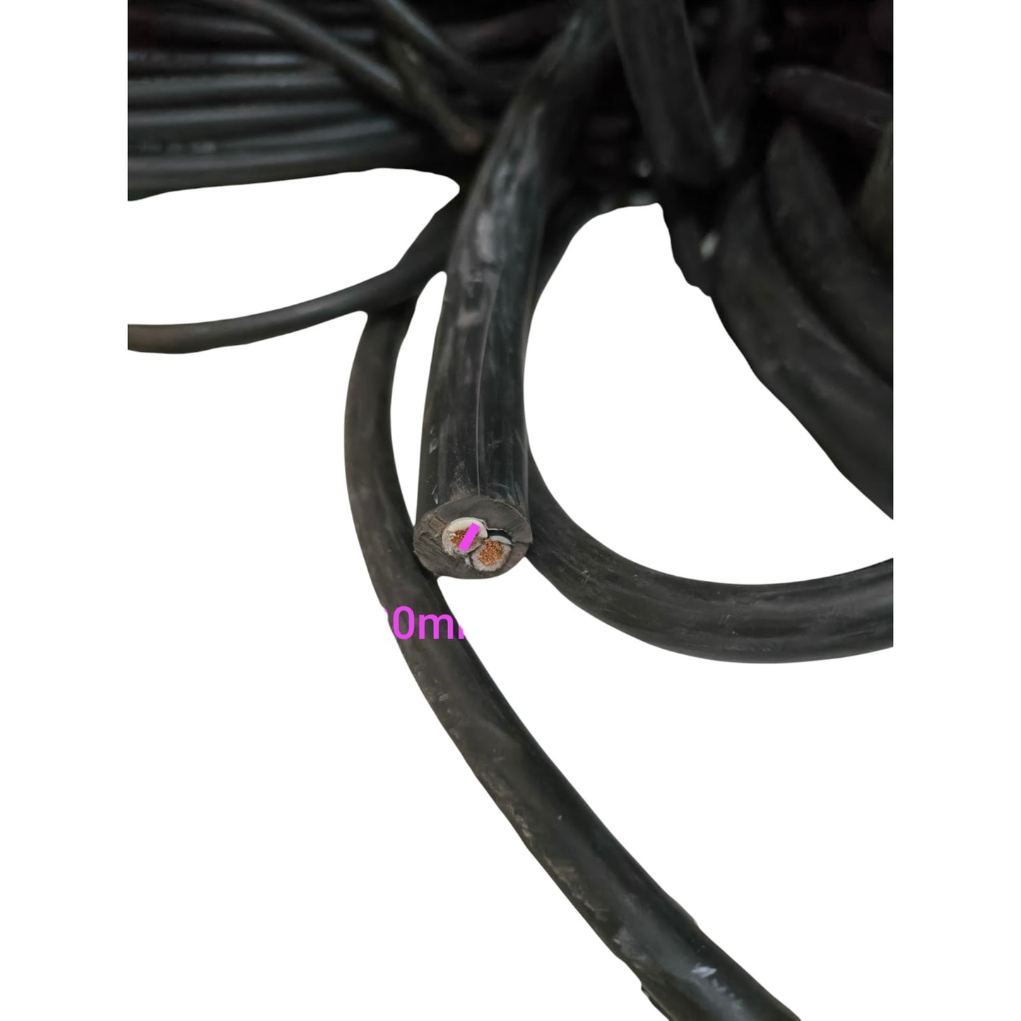 Close-up of black cable with measurement scale on a white background