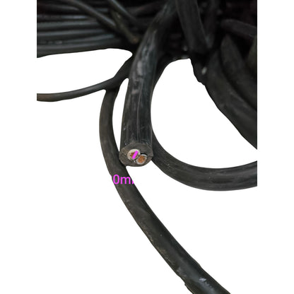 Close-up of black cable with measurement scale on a white background