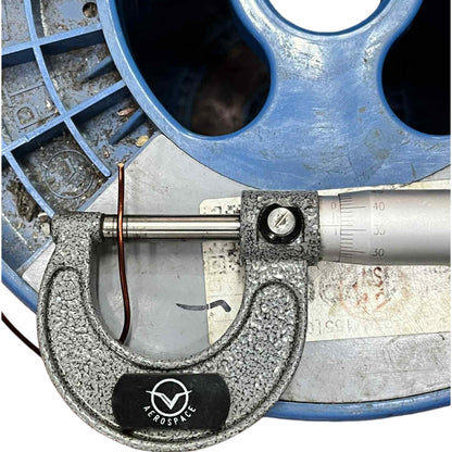 Micrometer with 'Aerospace' branding on a mechanical background