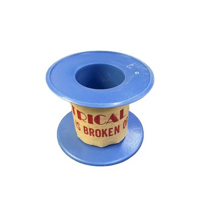 Blue spool with a yellow label on a white background
