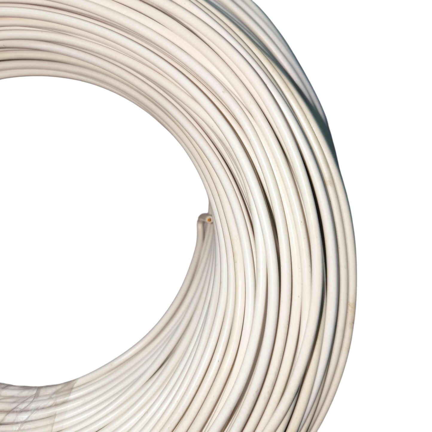 Coiled white cable on a white background