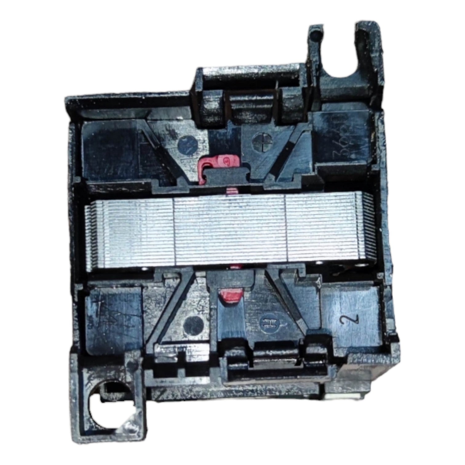 Close-up of a black plastic component with multiple parts on a white background