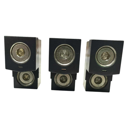 Set of four black speakers on a white background
