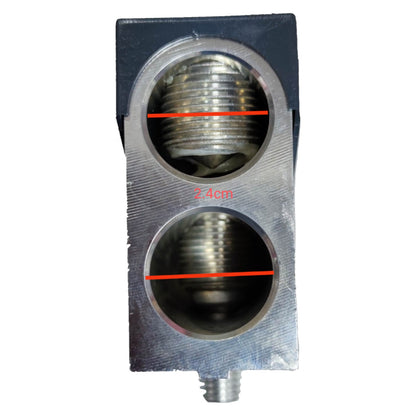 Metallic component with threaded holes on a white background