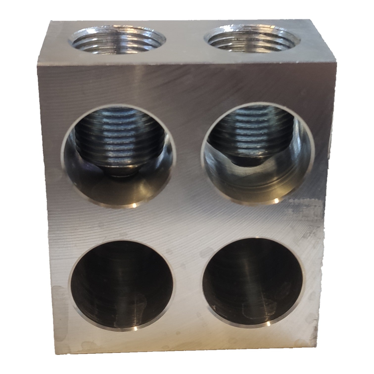 Metal block with multiple threaded holes on a white background