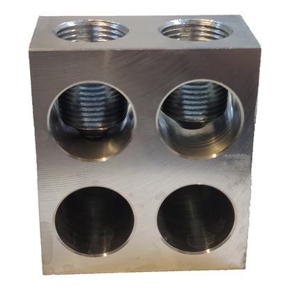 Metal block with multiple threaded holes on a white background