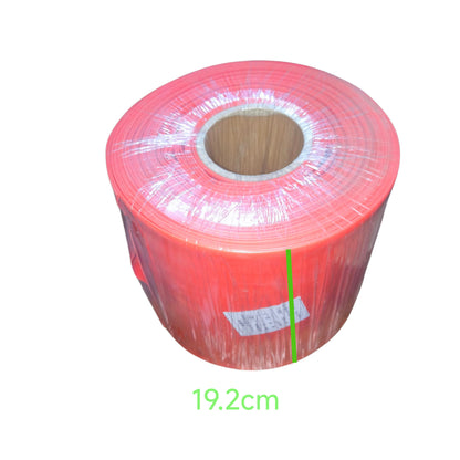 Roll of red plastic wrap with a measurement label on a white background