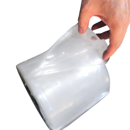 White plastic funnel held by a hand on a white background