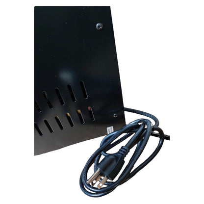 Black metal panel with a power cord on a white background