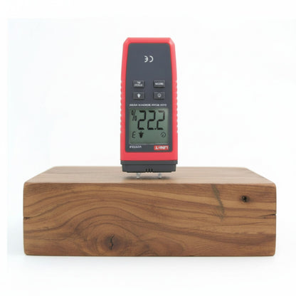 Digital moisture meter on a wooden block with a white background UNI-T Mini Digital Wood Moisture Tester UT377A with LCD Display Applicable for 4 Types of Wood Batteries not Included 3pcs AAA Electx Electrical SUpply