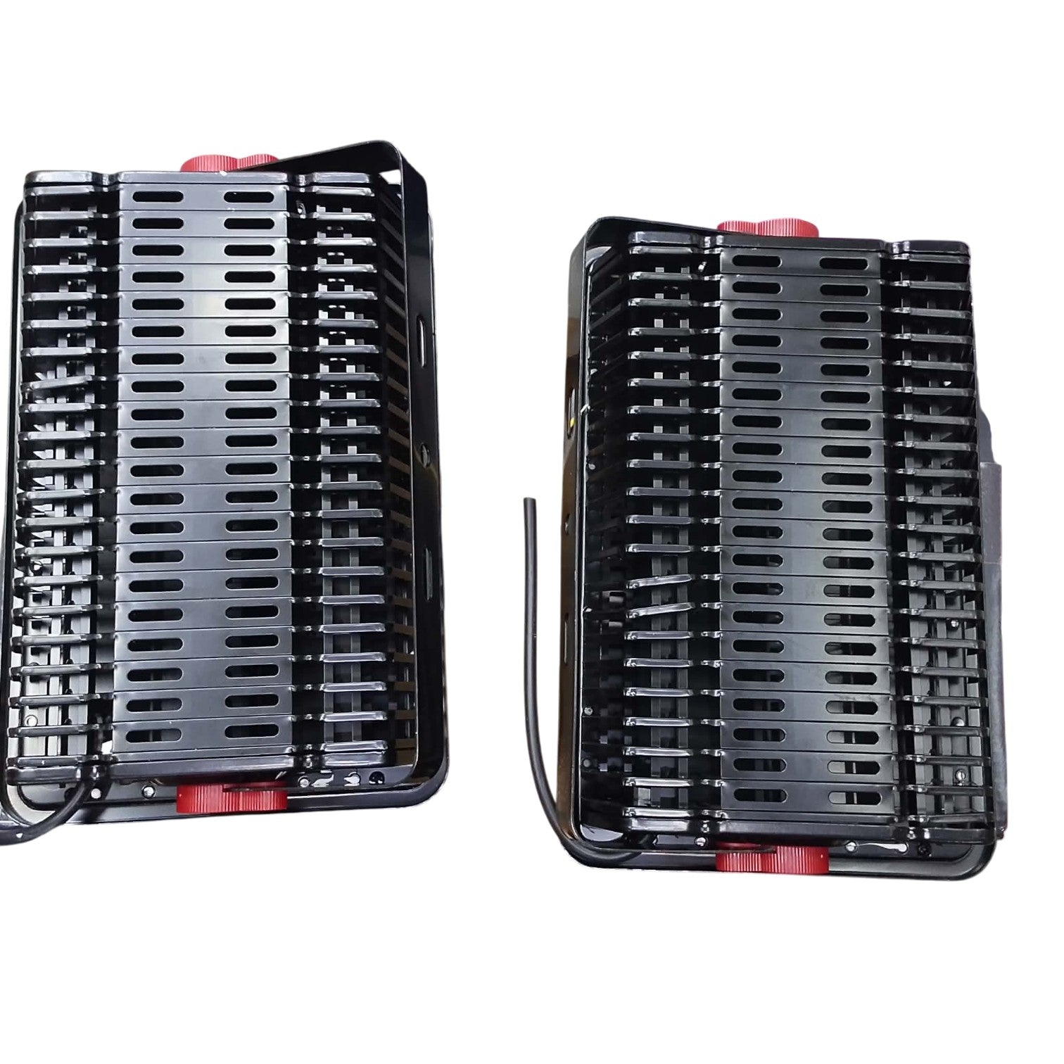 Two black plastic trays with red accents on a white background