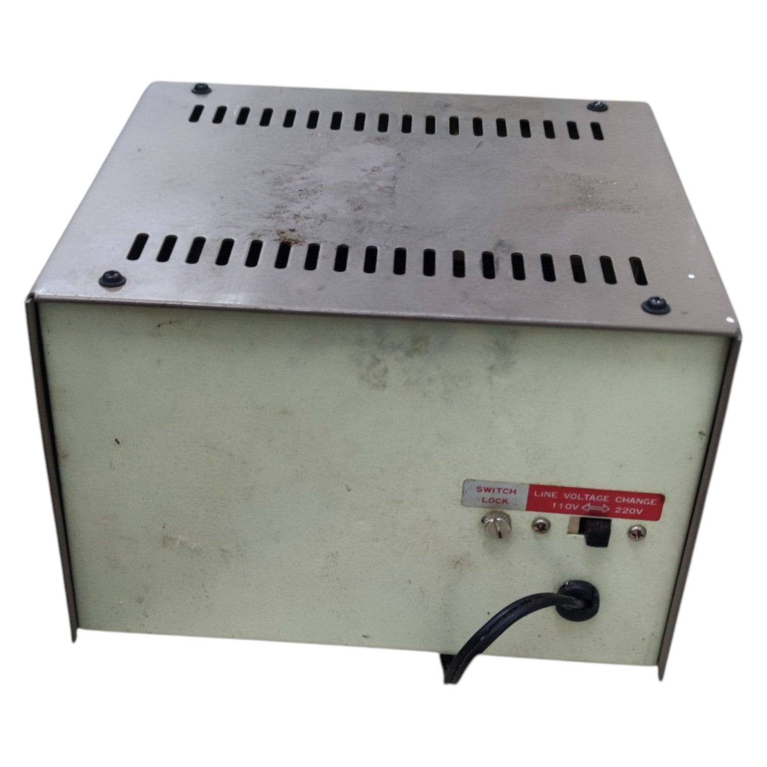 Vintage power supply unit with metal top and white base on a white background
