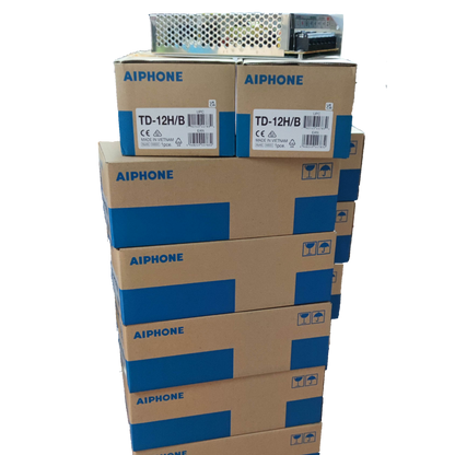 Stack of Aiphone 12 station intercom system boxes with security system equipment on top