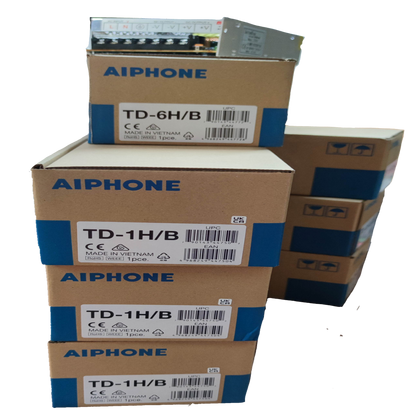 Stacked Aiphone boxes containing components for Aiphone 6 station intercom system CCTV and security system