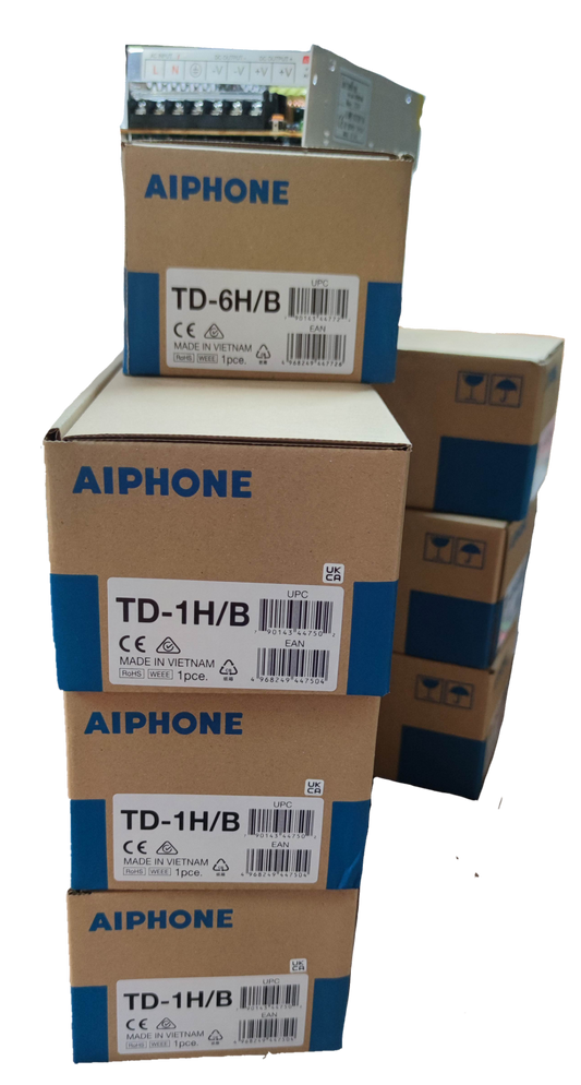 Stacked Aiphone boxes containing components for Aiphone 6 station intercom system CCTV and security system