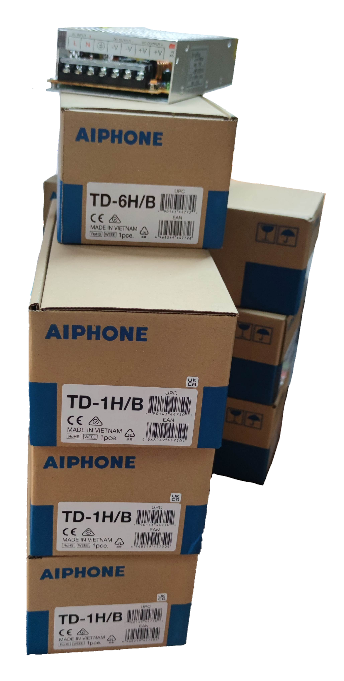 Stack of Aiphone boxes with intercom system components for Aiphone 6 station intercom system
