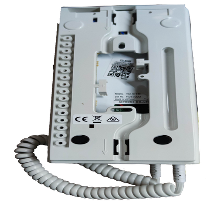 Back view of Aiphone 6 station intercom system showing wiring terminals and coiled cord