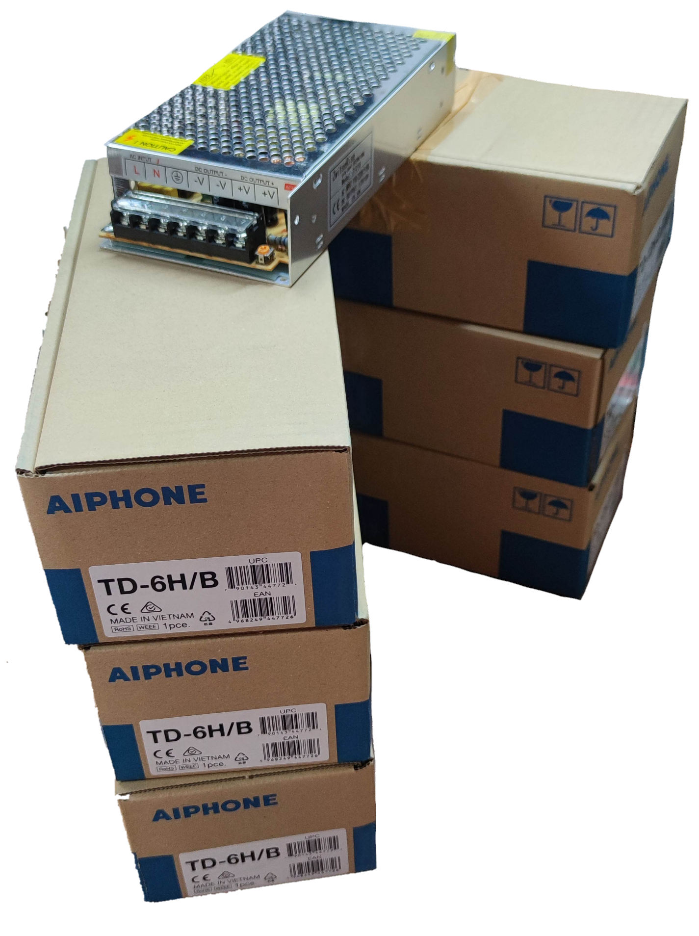 Aiphone 6 station intercom system power supply units stacked in boxes for CCTV and security system