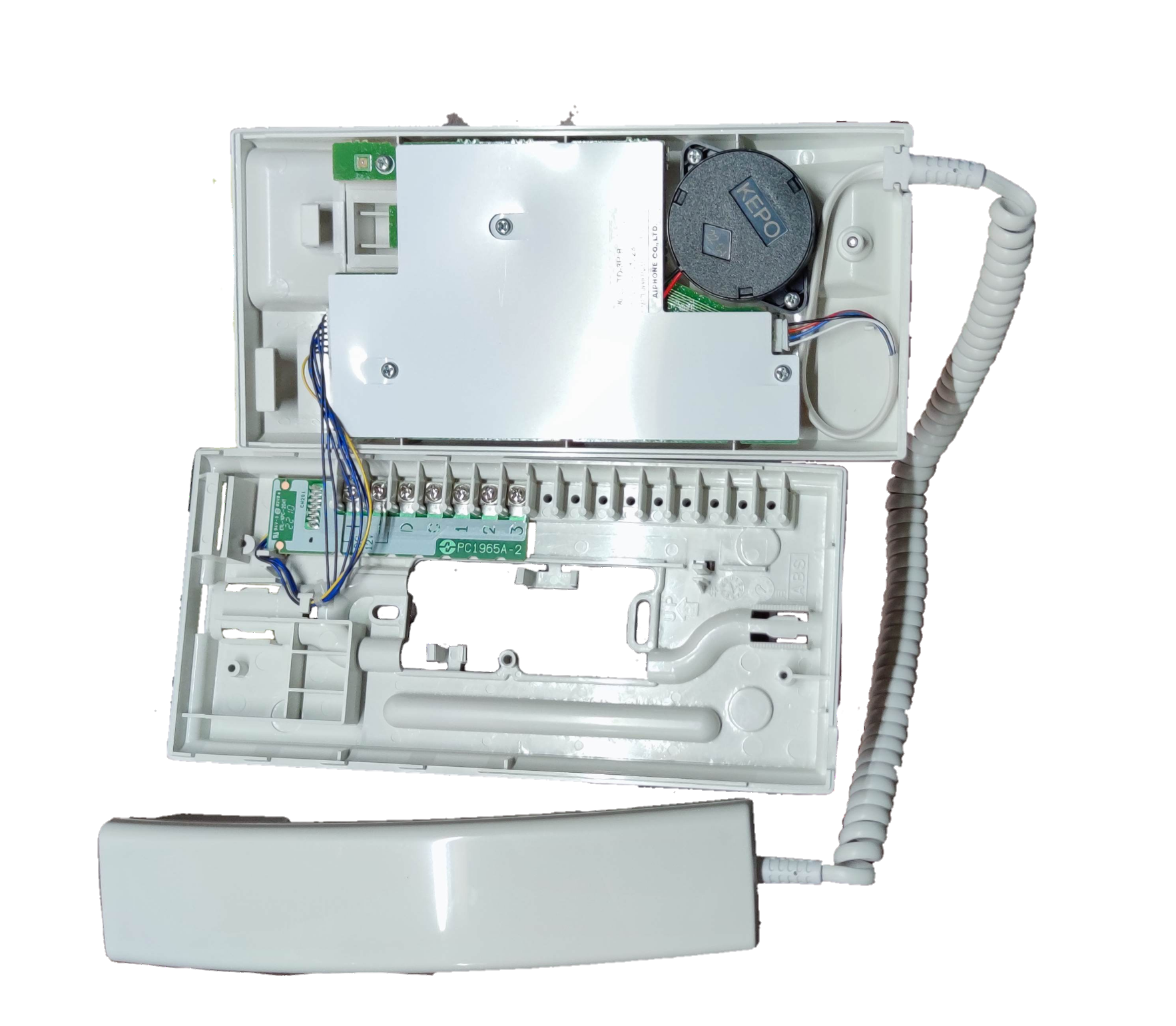 Aiphone intercom master unit opened showing internal wiring and white handset for security communication