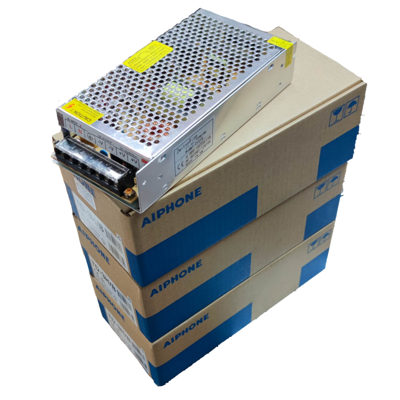 Aiphone intercom system power supply unit on stacked Aiphone branded boxes for CCTV and security system