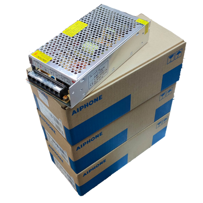 Aiphone intercom system power supply unit on stacked Aiphone branded boxes for CCTV and security system