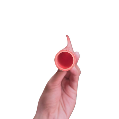 Hand holding a 25mm Permaline PVC conduit pipe in red from Atlanta Pipes Tubing and Hoses