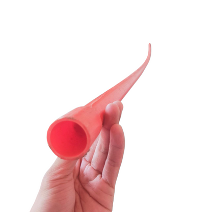 Hand holding 25mm Permaline PVC conduit pipe in bright red from Atlanta brand