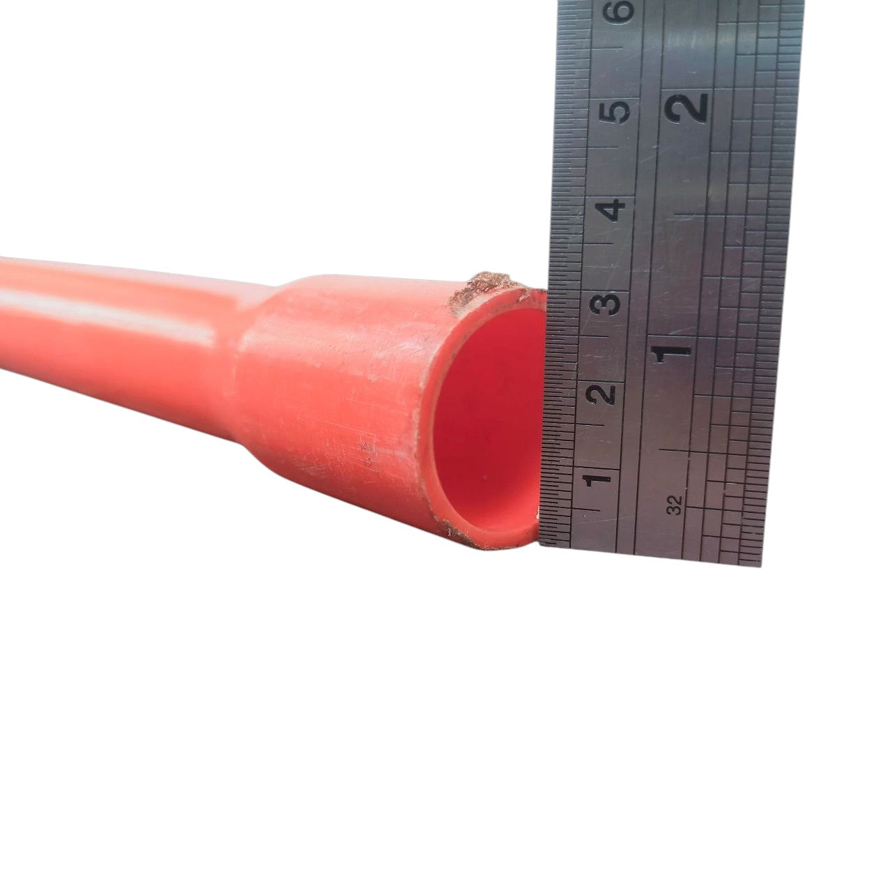 25mm Permaline PVC conduit by Atlanta measured with ruler showing pipe diameter