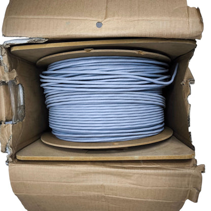 Belden Cat6 cable 300 meters neatly coiled on a spool inside an open cardboard box