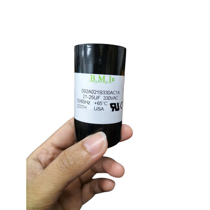 BMI Starting Capacitor 21-25MFD 330V in hand, suitable for various motor applications
