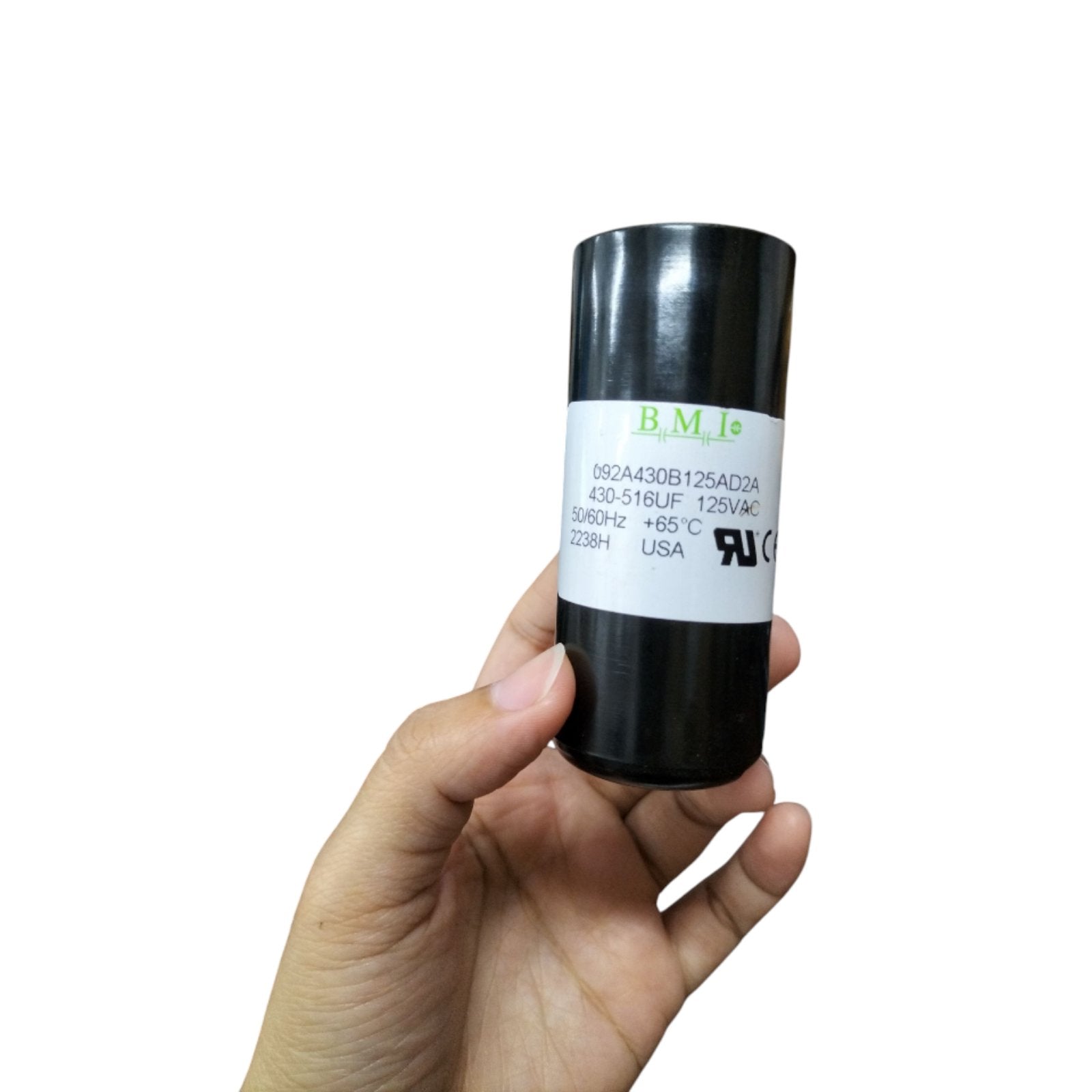 BMI motor start capacitor 125V AC 430-516UF in hand, perfect for HVAC and motor applications