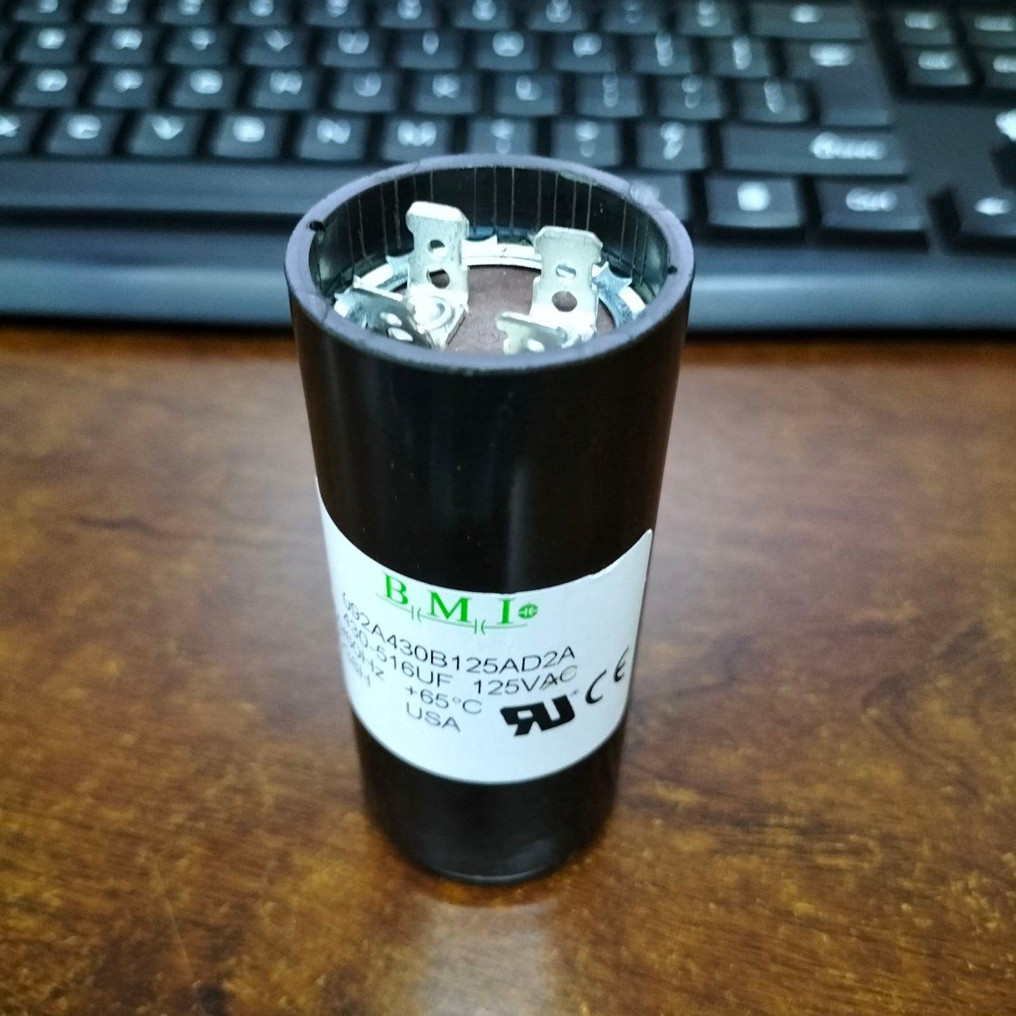 BMI motor start capacitor 125V AC 430-516UF with durable housing for efficient electric motor performance