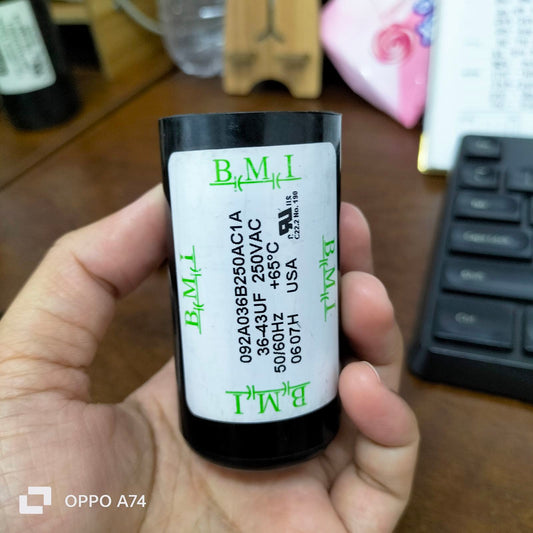 BMI Starting Capacitor 36-43 UF held in hand showing specifications and rating details