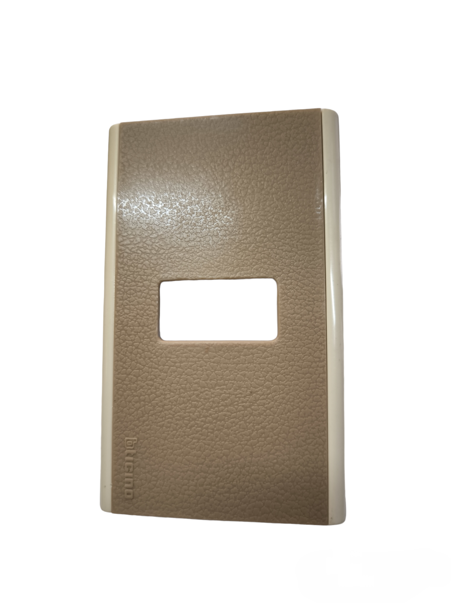 Bticino switch plate cover in textured brown and beige for power points and switches