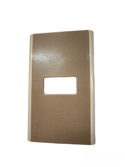 Bticino switch plate cover in textured brown and beige for power points and switches