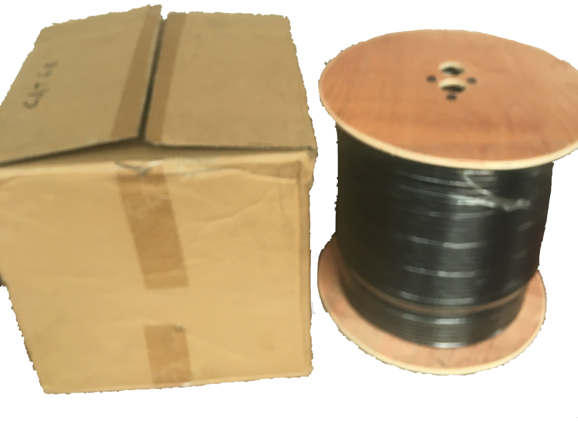 AMP LAN Cable Weatherproof black outdoor network cable on wooden spool next to cardboard box
