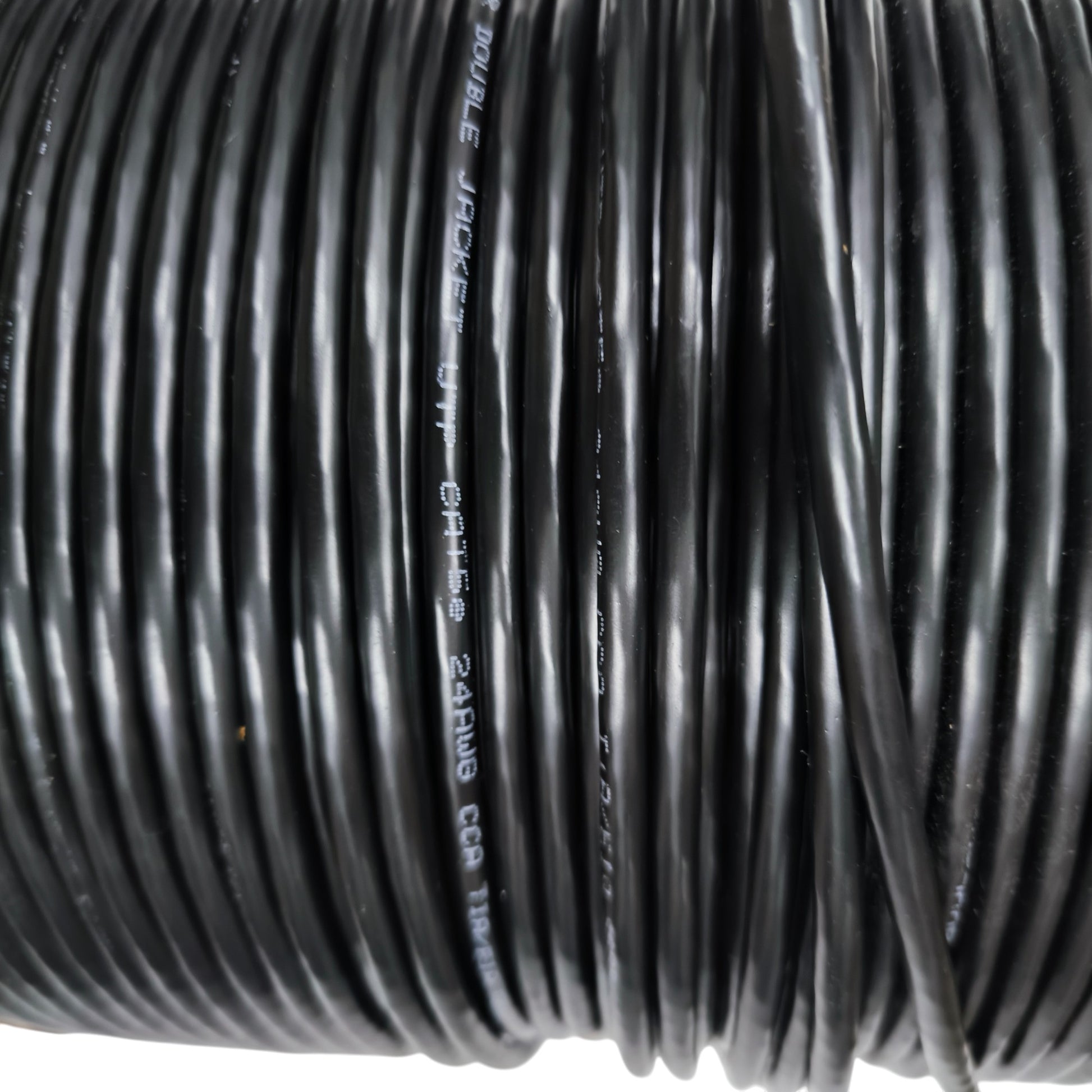 Black coiled network cable on a spool CAT5e UTP Weatherproof outdoor rated cable from China vendor