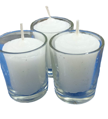 Set of three candle with glass white holders filled with white wax and unlit wicks