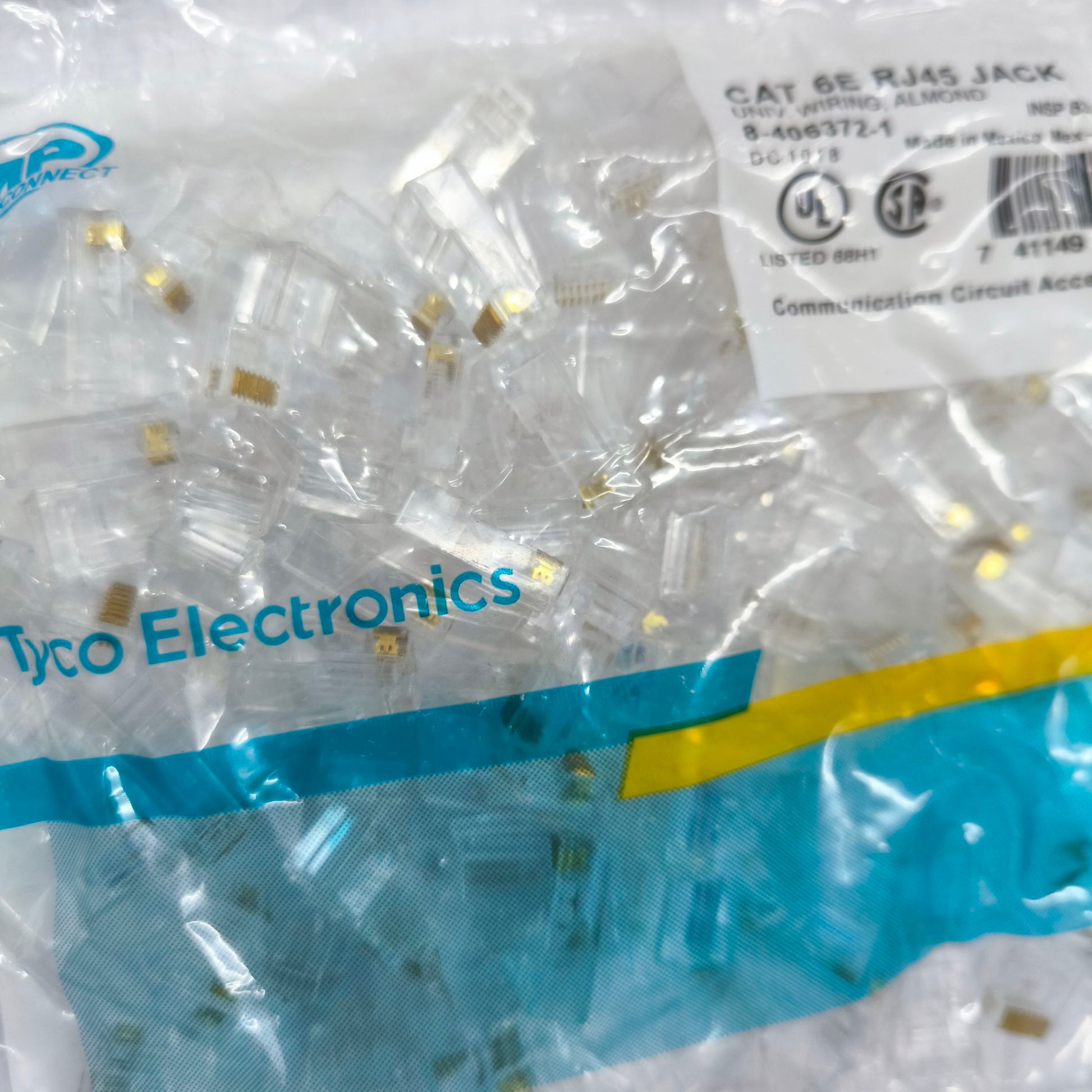 Bulk pack of clear CAT 6E RJ45 plug connectors from AMP for reliable network connections
