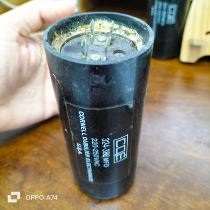 Starting Capacitor CDE Brand 324-388 MFD black cylindrical electrical component with metal connectors