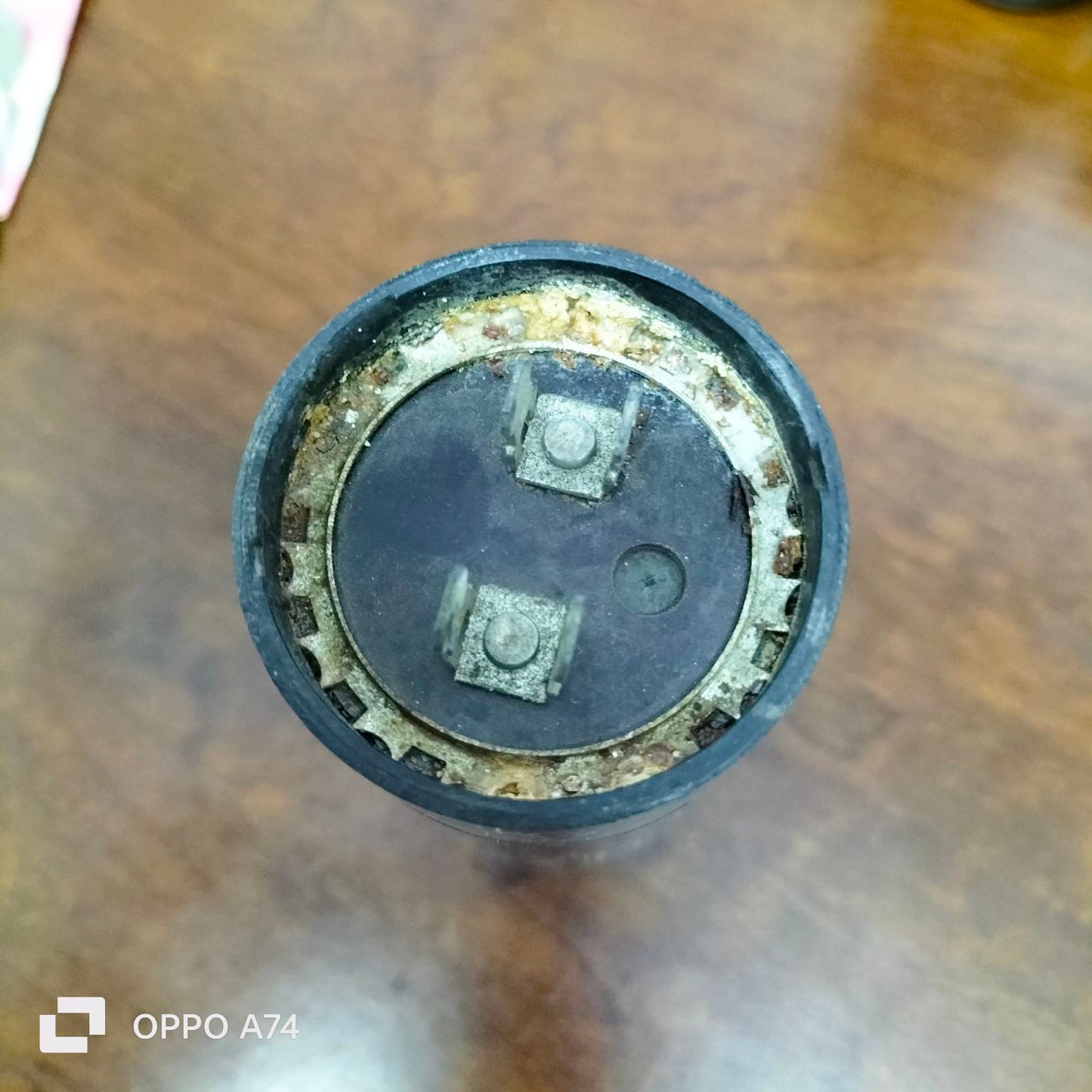 Starting Capacitor CDE Brand 324-388 MFD with metal terminals and round black casing for electrical circuitry