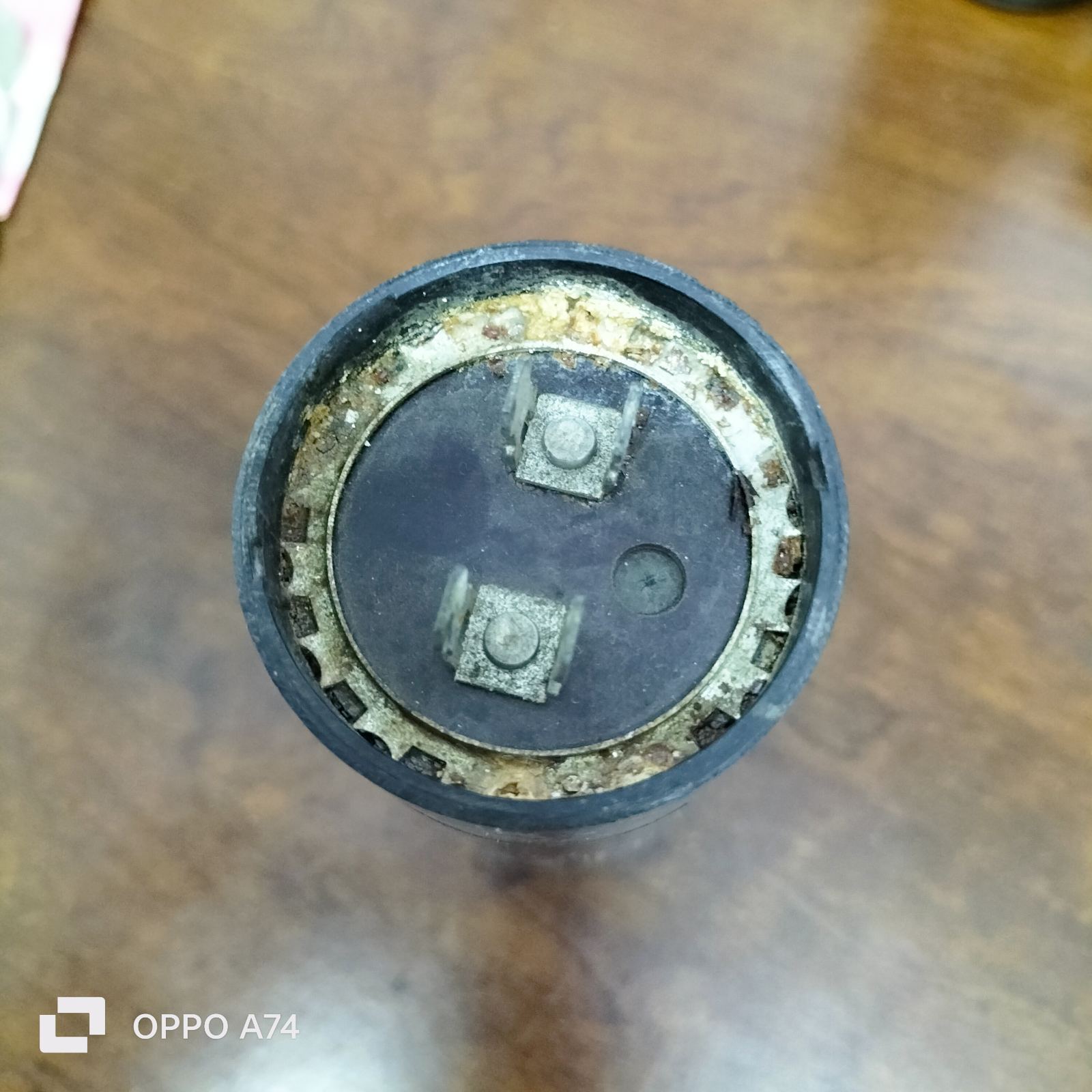 Starting Capacitor CDE Brand 324-388 MFD with metal terminals and round black casing for electrical circuitry