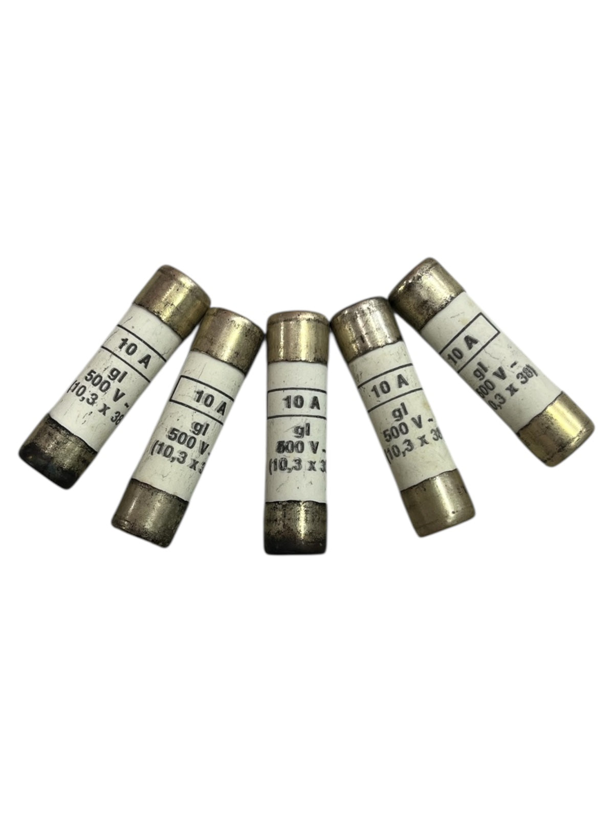 Five ceramic fuse 10A 500V 10x38mm electrical components with metal end caps arranged on a white background