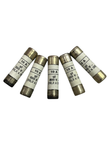 Five ceramic fuse 10A 500V 10x38mm electrical components with metal end caps arranged on a white background