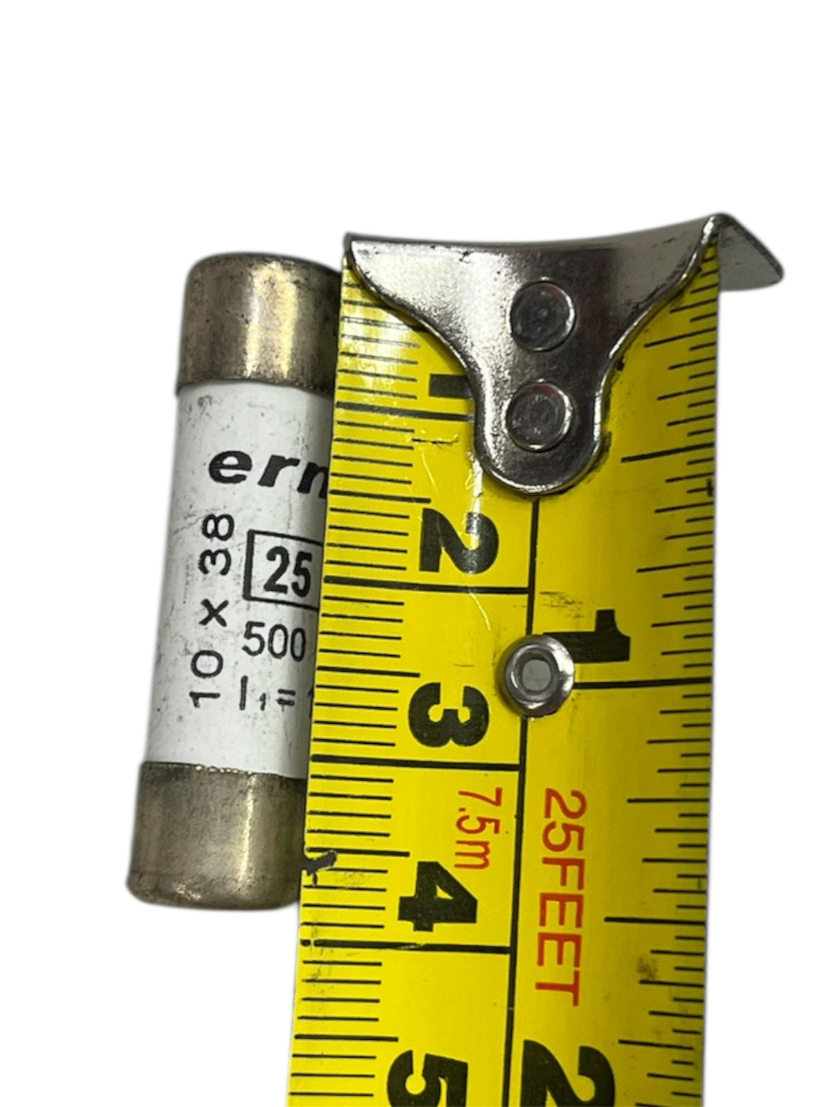 Ceramic Fuse 25A 500V 10x38mm next to yellow measuring tape showing fuse size