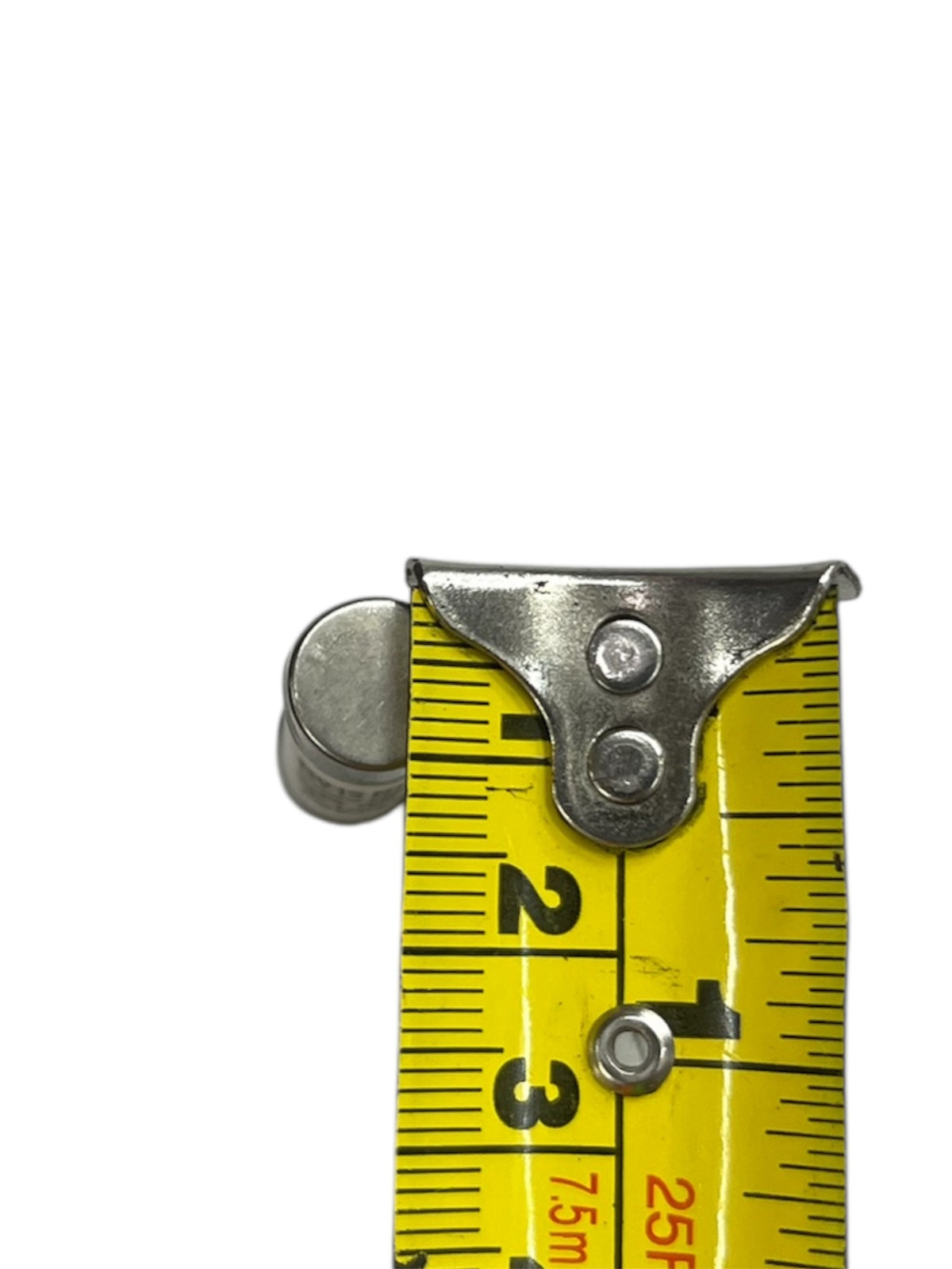 Close-up of ceramic fuse 32A 500V 10x38mm next to yellow measuring tape showing size